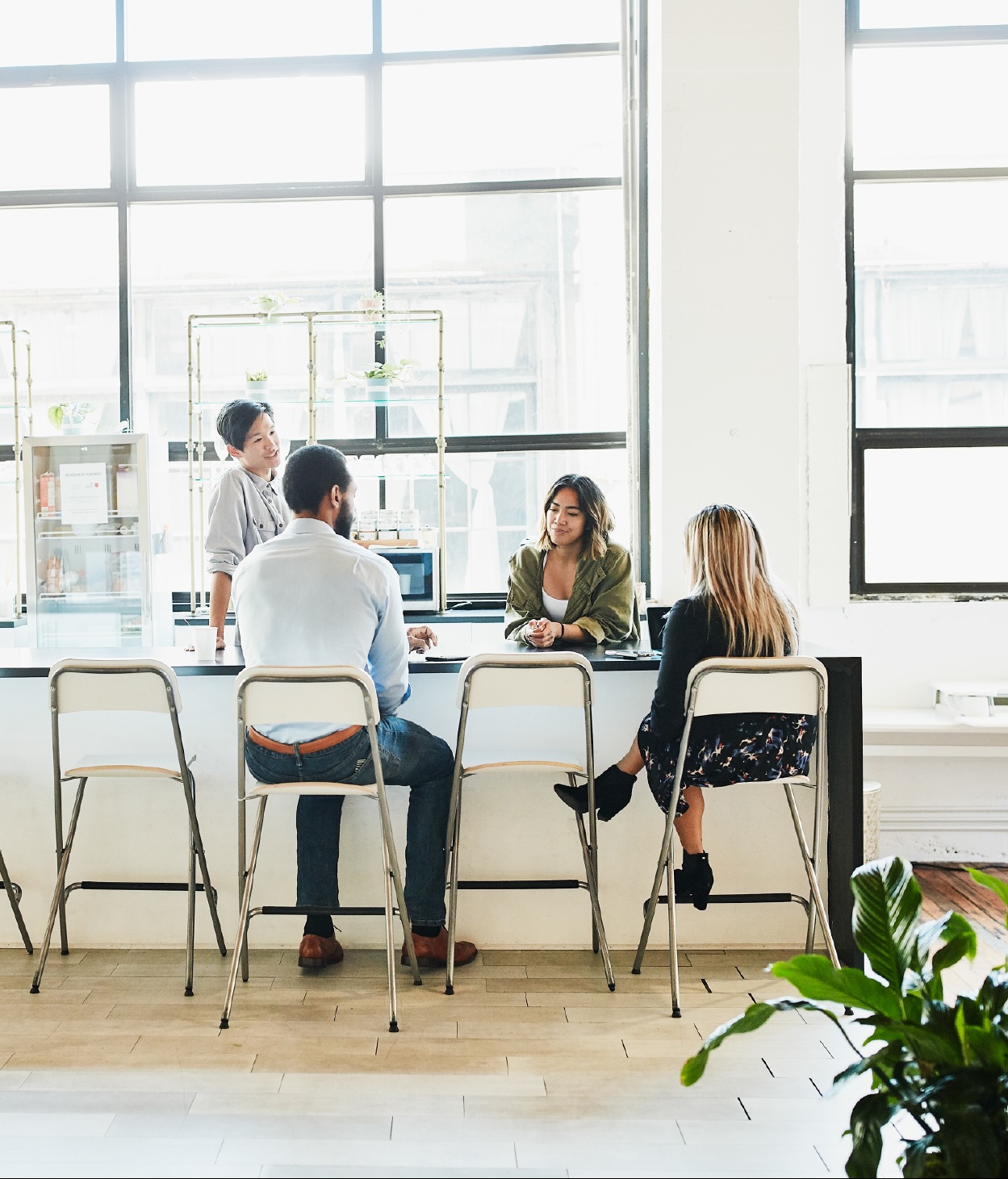 Coworkers having a chat in the company breakroom
