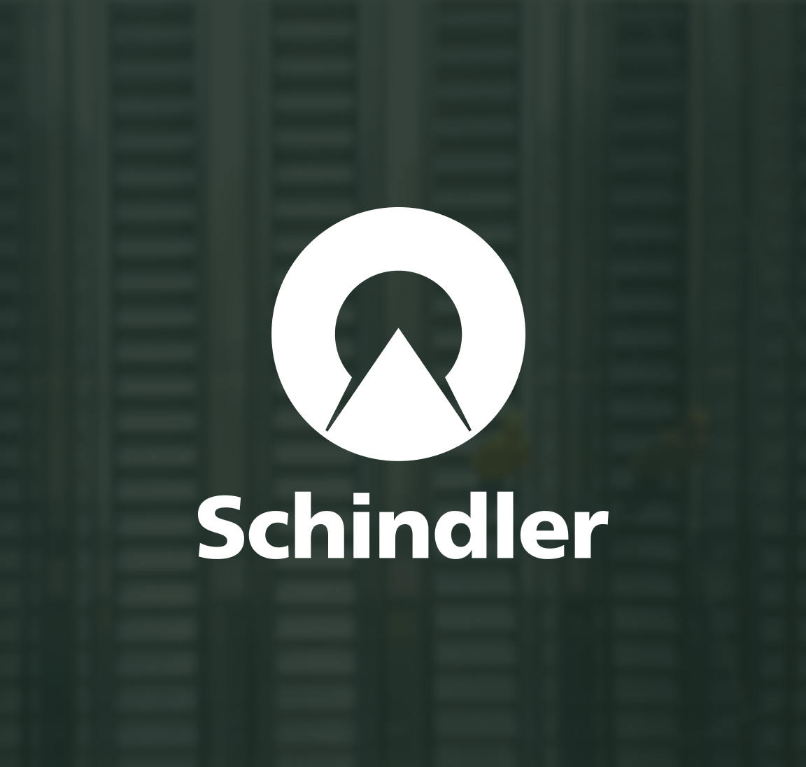Schindler logo over a blurred image of escalators